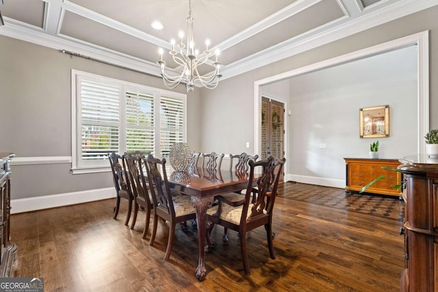 dining room featuring dark wood-type flooring, ornamental molding, and an inviting chandelier