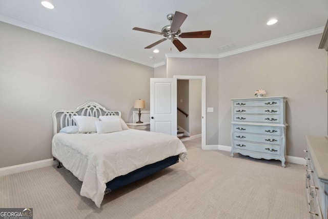 carpeted bedroom with ceiling fan and crown molding