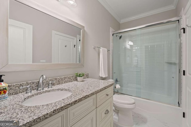 full bathroom with crown molding, vanity, enclosed tub / shower combo, and toilet