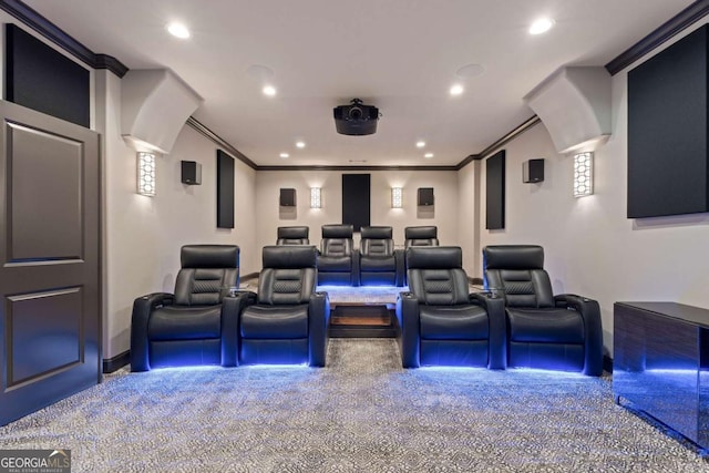 home theater with carpet and crown molding