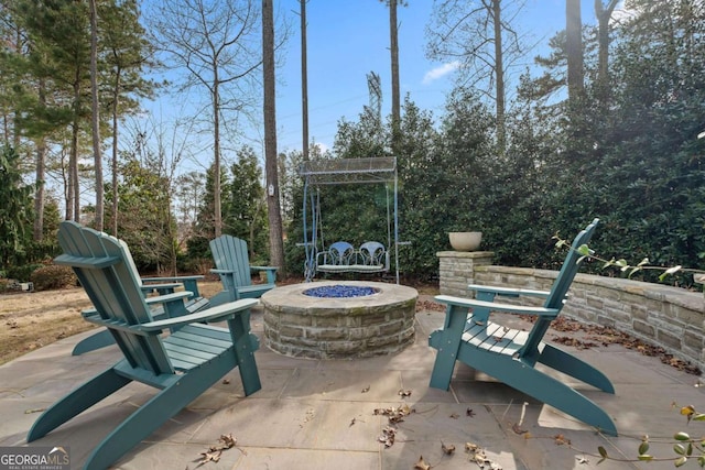 view of patio with a fire pit