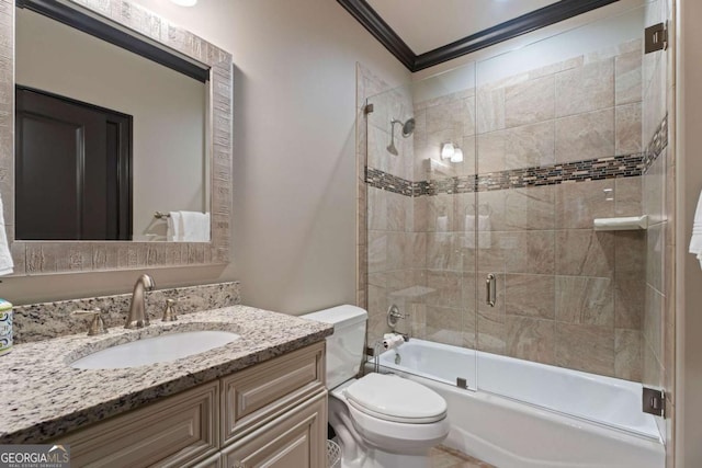 full bathroom with vanity, toilet, ornamental molding, and bath / shower combo with glass door