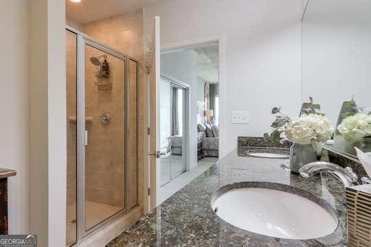 bathroom featuring vanity and walk in shower