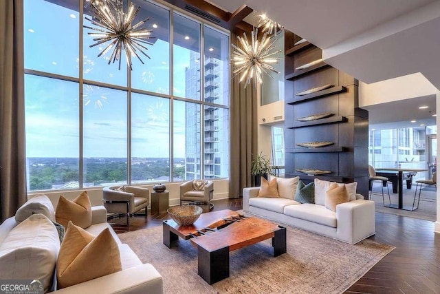 living room with parquet flooring and a chandelier