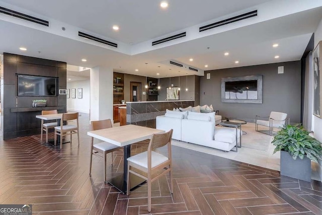 dining room with dark parquet flooring