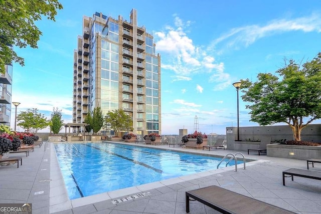 view of pool featuring a patio