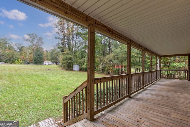 wooden deck with a yard