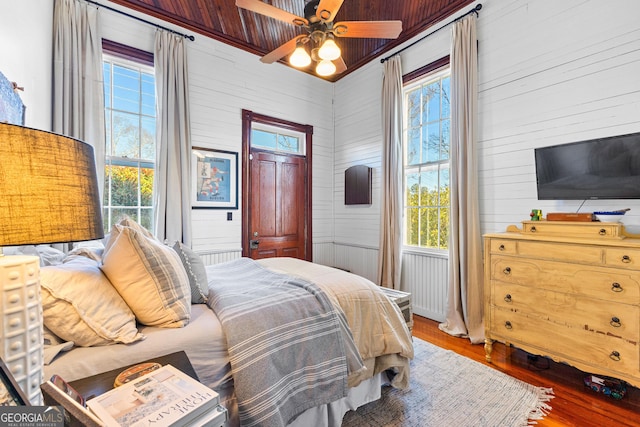 bedroom with wood-type flooring, ceiling fan, and wood ceiling