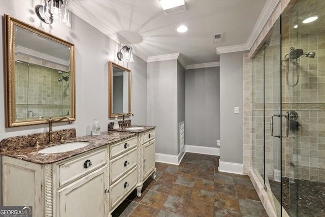 bathroom featuring vanity, a shower with door, ornamental molding, and toilet