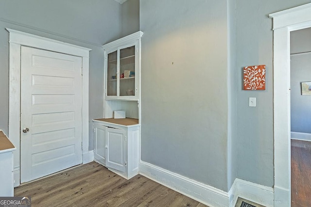 hallway featuring dark hardwood / wood-style floors