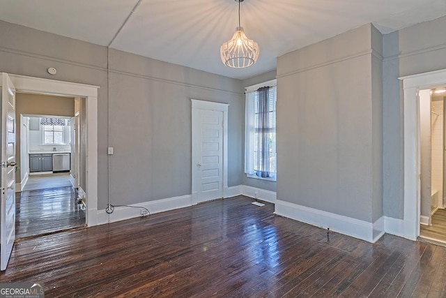 unfurnished room with dark hardwood / wood-style floors