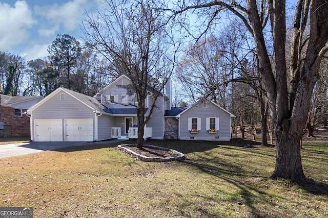 front of property with a front yard and a garage