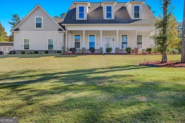 view of front of home featuring a porch and a front lawn