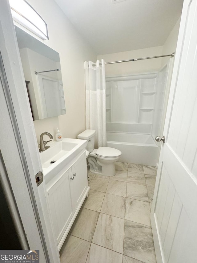 full bathroom featuring toilet, vanity, and shower / tub combo with curtain