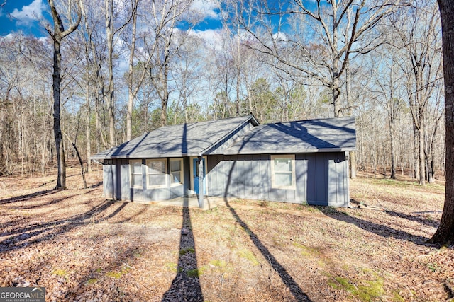 view of front of house with a shingled roof