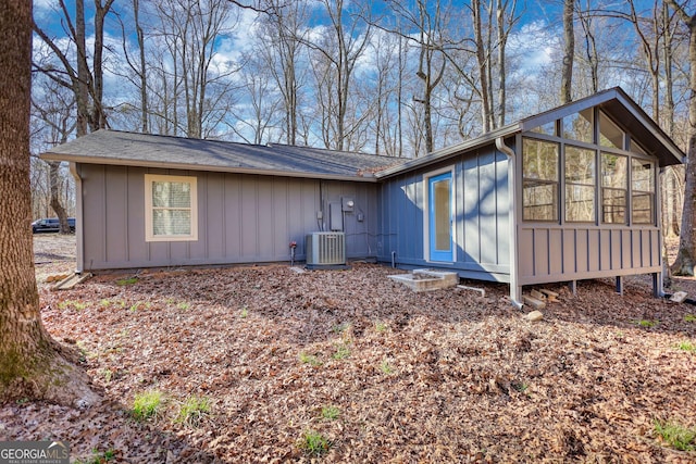 view of property exterior featuring board and batten siding and central air condition unit