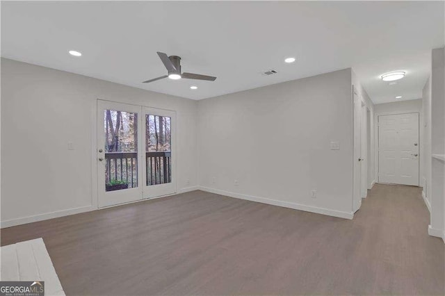 unfurnished room featuring ceiling fan and light hardwood / wood-style floors