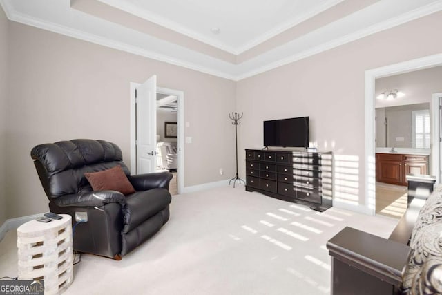 living area featuring light carpet, a raised ceiling, and ornamental molding