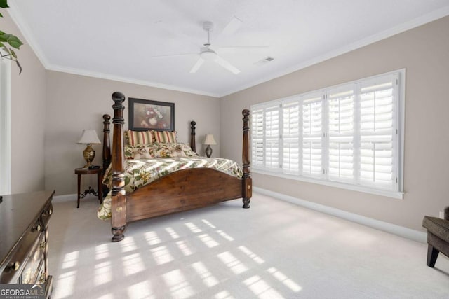 bedroom featuring light colored carpet, ceiling fan, and crown molding