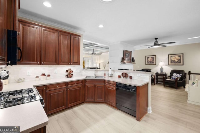 kitchen featuring sink, light hardwood / wood-style floors, black dishwasher, beam ceiling, and kitchen peninsula