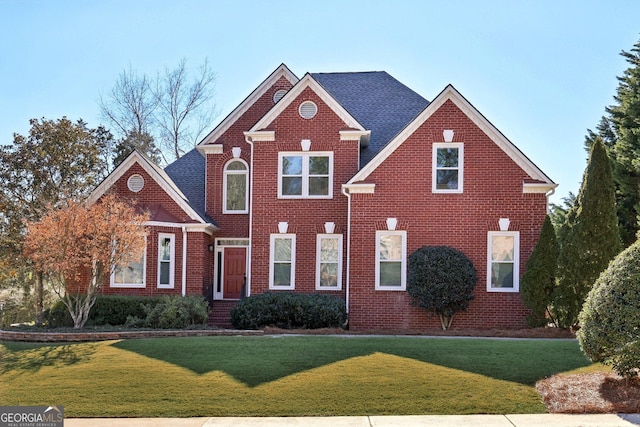 front facade featuring a front lawn