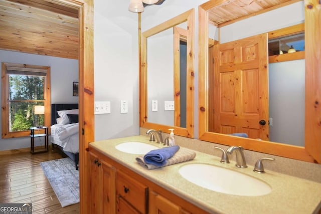 bathroom featuring vanity, wood ceiling, and hardwood / wood-style flooring