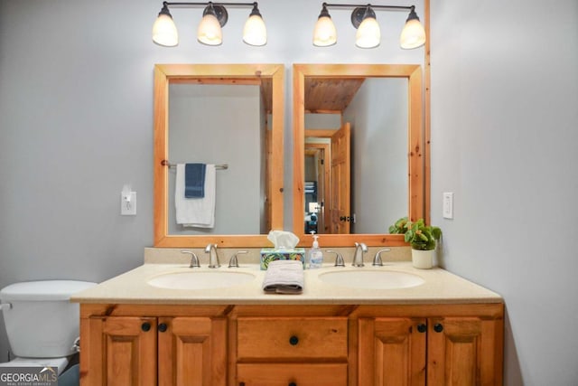 bathroom with vanity and toilet