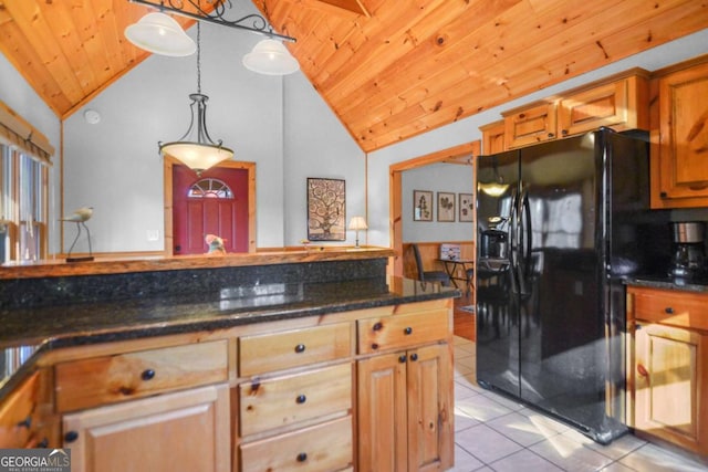 kitchen with black fridge, hanging light fixtures, and wood ceiling