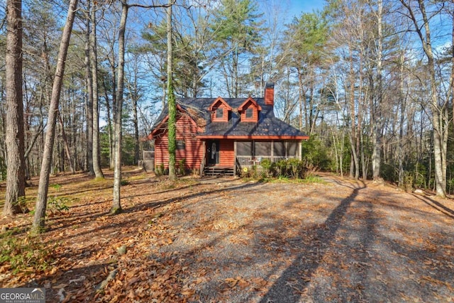 view of front of home featuring a sunroom