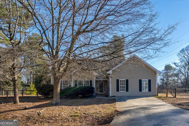 view of front of property featuring fence