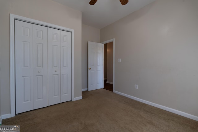 unfurnished bedroom featuring ceiling fan, carpet floors, a closet, and baseboards