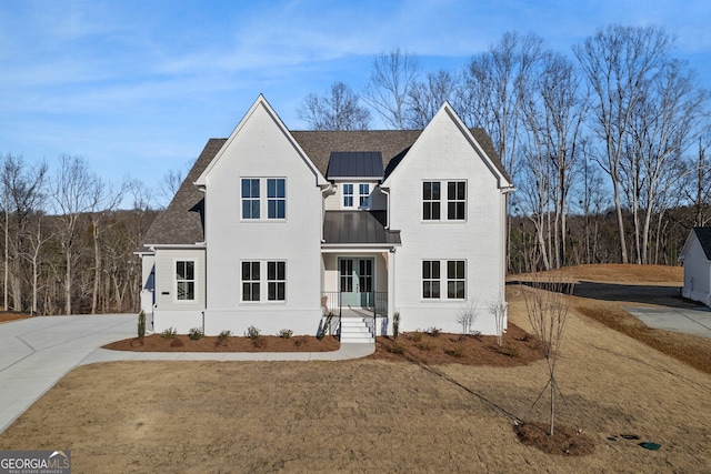 view of front of home featuring solar panels