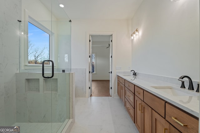 bathroom featuring vanity, an enclosed shower, and ceiling fan