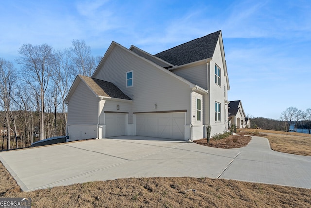 view of side of property with a garage