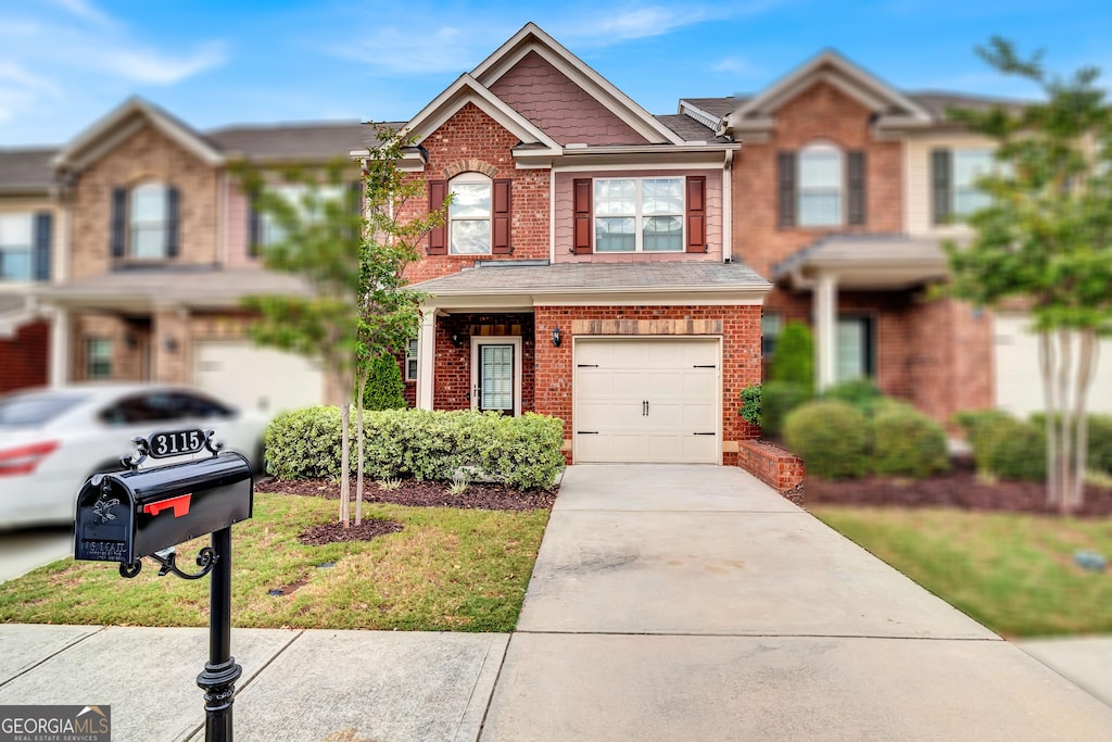 view of front facade featuring a garage and a front yard