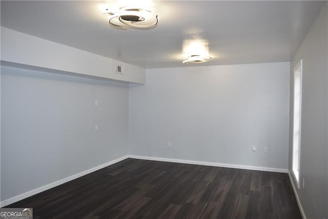 basement with dark wood-type flooring