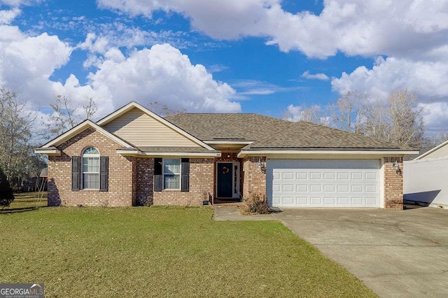 ranch-style house featuring a front lawn and a garage