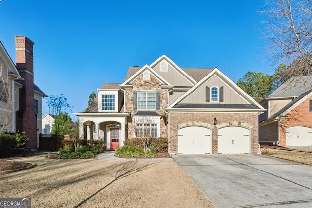 view of front of home featuring a garage and a front lawn