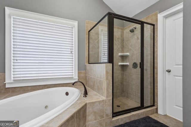 bathroom featuring separate shower and tub, tile patterned flooring, and lofted ceiling