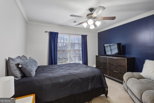 bedroom with ornamental molding, ceiling fan, and light carpet