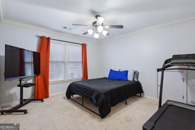 carpeted bedroom featuring ceiling fan and ornamental molding