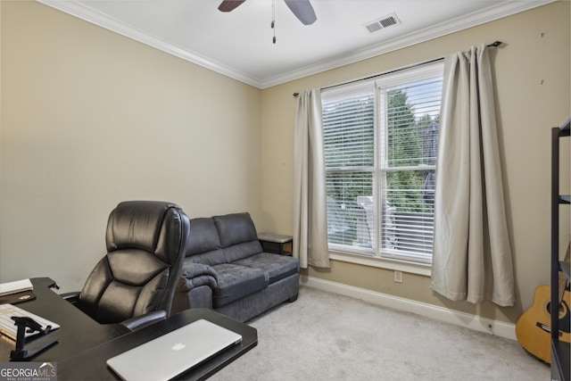 office area featuring ceiling fan, crown molding, and light colored carpet