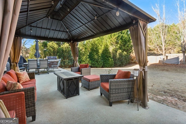 view of patio / terrace with outdoor lounge area and a gazebo