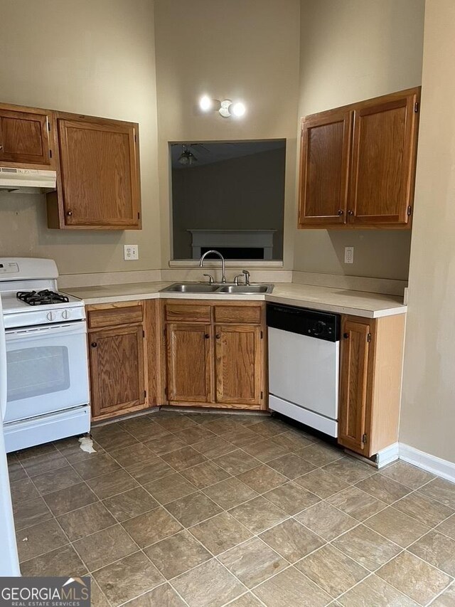 kitchen with white appliances and sink