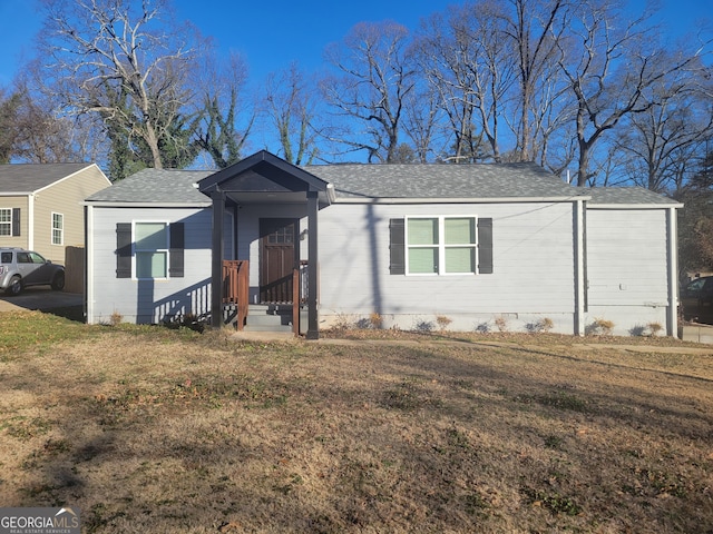 single story home featuring a front yard