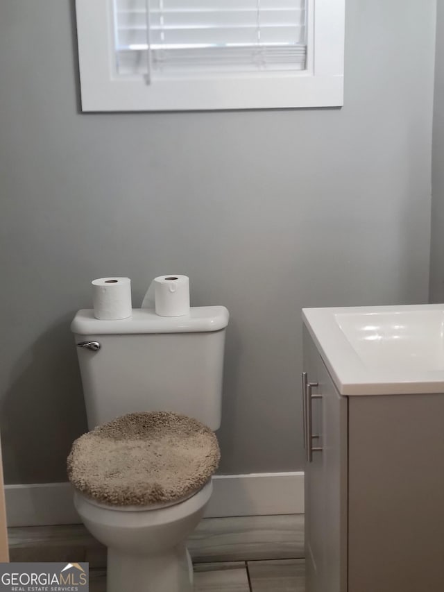 bathroom with vanity and toilet