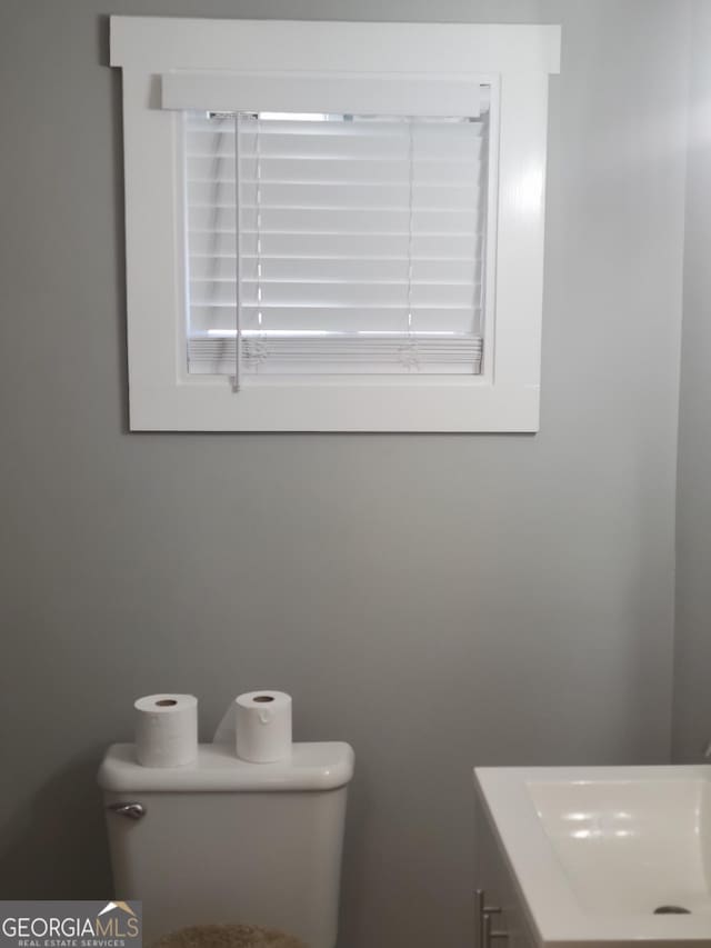 bathroom featuring toilet and sink