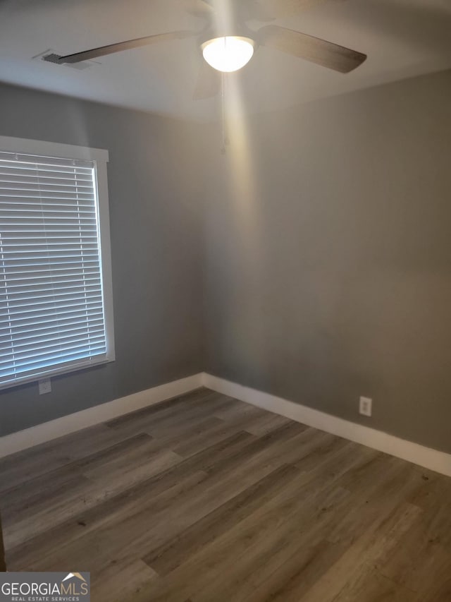 spare room featuring dark hardwood / wood-style flooring