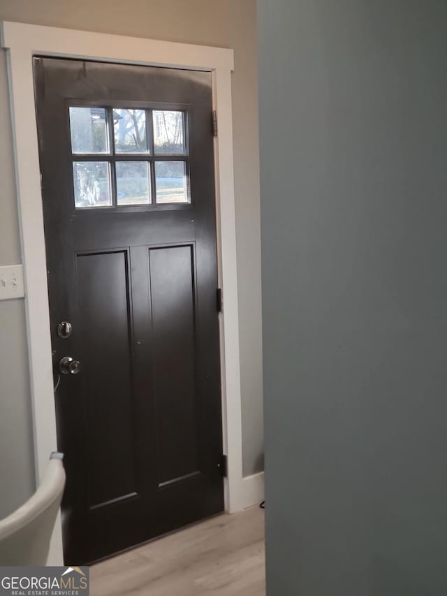 entryway with light hardwood / wood-style floors