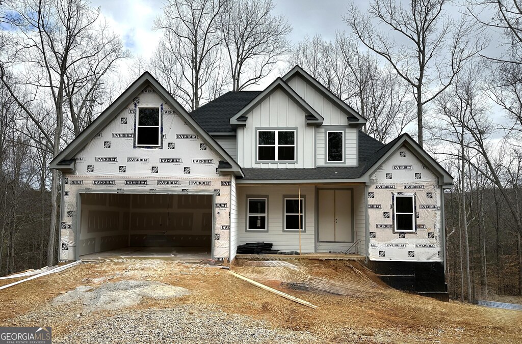 unfinished property with covered porch